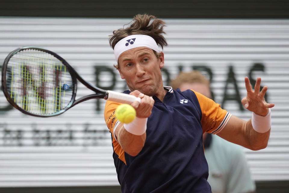 FILE - Norway's Casper Ruud plays a shot against Serbia's Novak Djokovic during the men's singles final match of the French Open tennis tournament at the Roland Garros stadium in Paris, Sunday, June 11, 2023. Ruud is expected to compete at Wimbledon next week. (AP Photo/Christophe Ena, File)