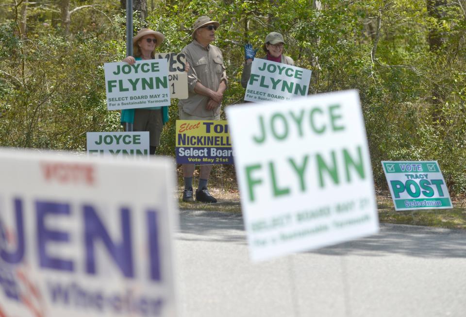 Select Board candidate Joyce Flynn, right, campaigns outside the Yarmouth Senior Center with residents Irene Paine and Jim Wolf Tuesday afternoon. Flynn was successful in her bid for the Select Board seat.