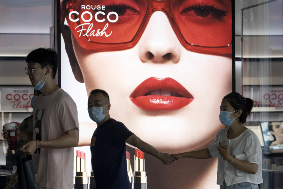 Residents wear face masks as they visit a mall in Beijing Thursday, June 25, 2020. In China, where the virus first appeared late last year, an outbreak in Beijing appeared to have been brought under control. (AP Photo/Ng Han Guan)