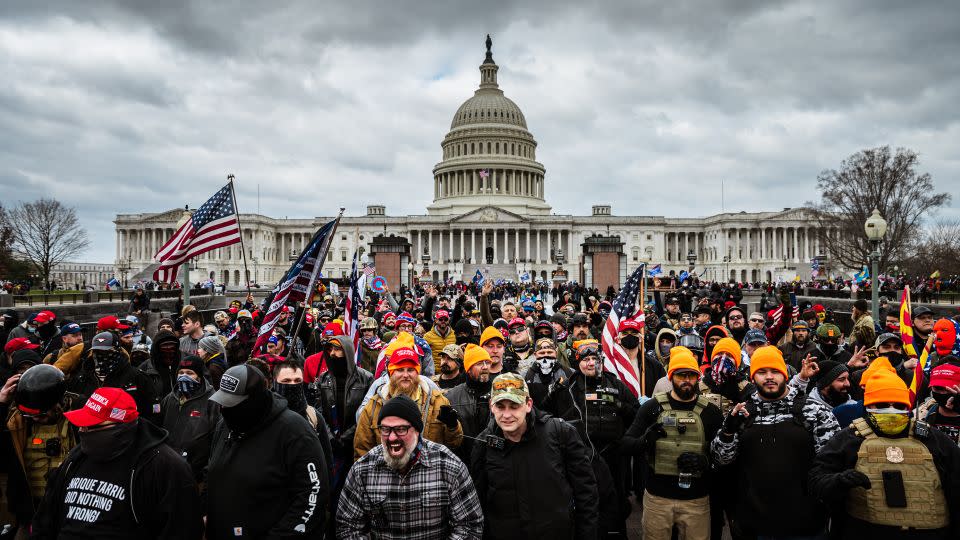 Pro-Trump protesters gather in front of the US Capitol on January 6, 2021, in Washington, DC. A pro-Trump mob would storm the Capitol that day in an attempt to overturn Trump's 2020 presidential loss to Joe Biden. - Jon Cherry/Getty Images