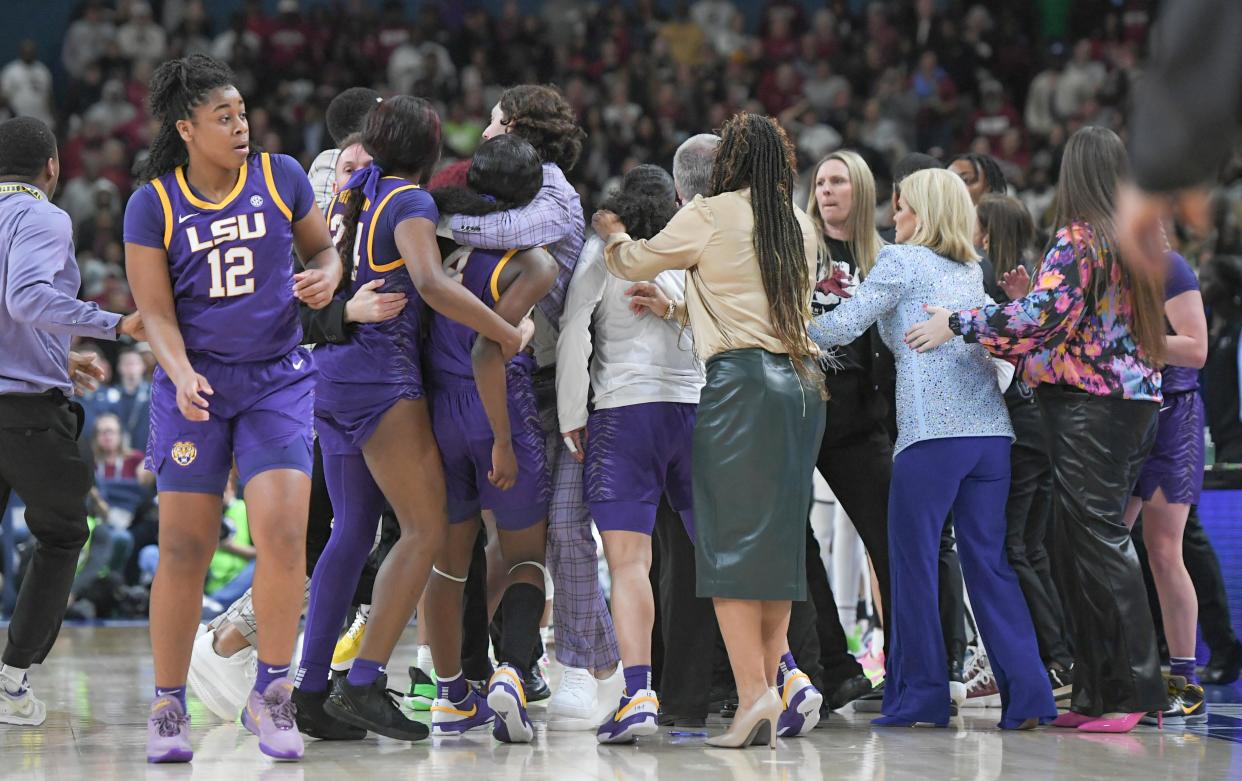 South Carolina and LSU players scuffle during the fourth quarter of Sunday's SEC women's tournament championship game in Greenville, S.C. Six players were ejected.