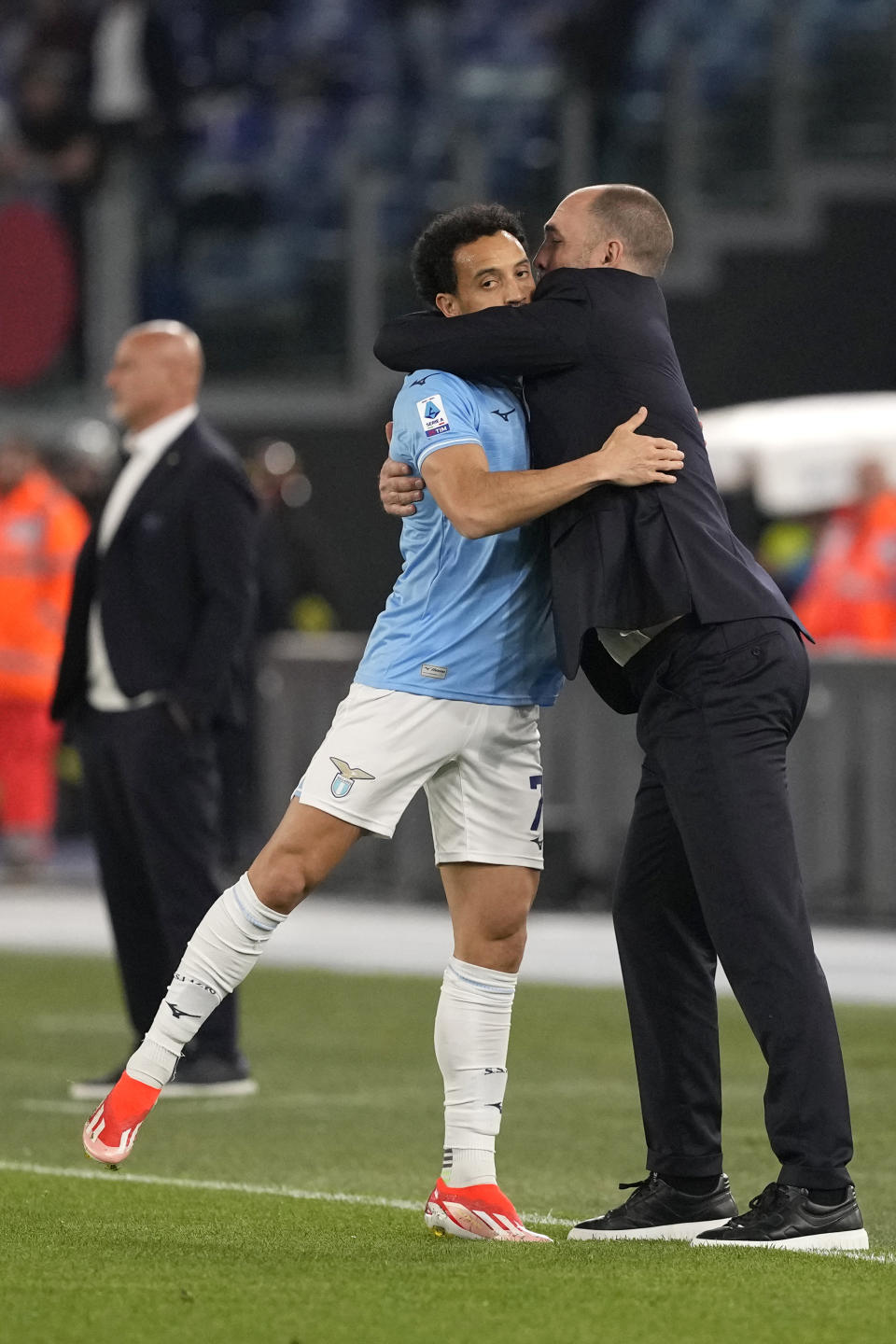 Lazio's Felipe Anderson celebrates with Lazio's head coach Igor Tudor after scoring his side's opening goal during the Serie A soccer match between Lazio and Salernitana at Rome's Olympic Stadium, Rome, Italy, Friday, April 12, 2024. (AP Photo/Andrew Medichini)