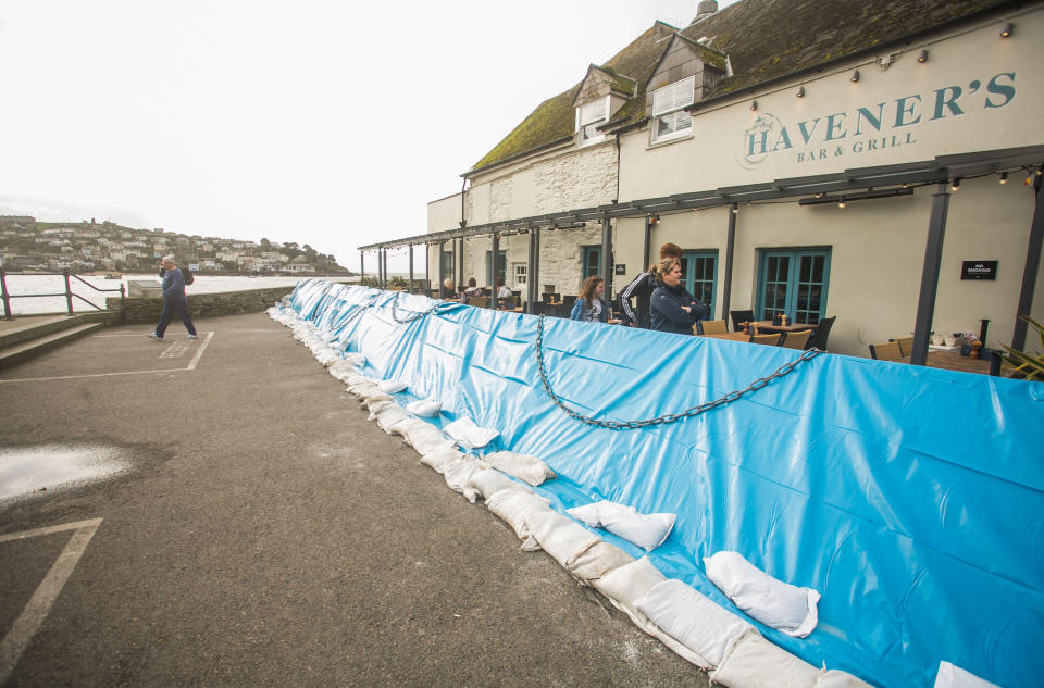 <em>Prepared – temporary flood barriers have been erected in Fowey, Cornwall, ahead of the arrival of Storm Brian (Picture: SWNS)</em>