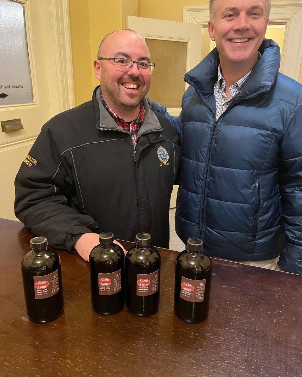 Ian Abreu, right, with Mayor Jon Mitchell, left, celebrating the return of Silmo Syrup at a pop-up.