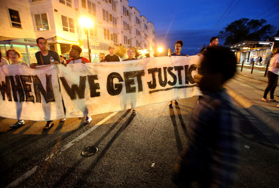 <p>Protesters walk along a street after a vigil outside the state Capitol in St. Paul, Minn., Friday, June 16, 2017. A Minnesota police officer was cleared earlier Friday in the fatal shooting of Philando Castile, a black motorist whose death captured national attention when his girlfriend streamed the grim aftermath on Facebook. (David Joles/Star Tribune via AP) </p>