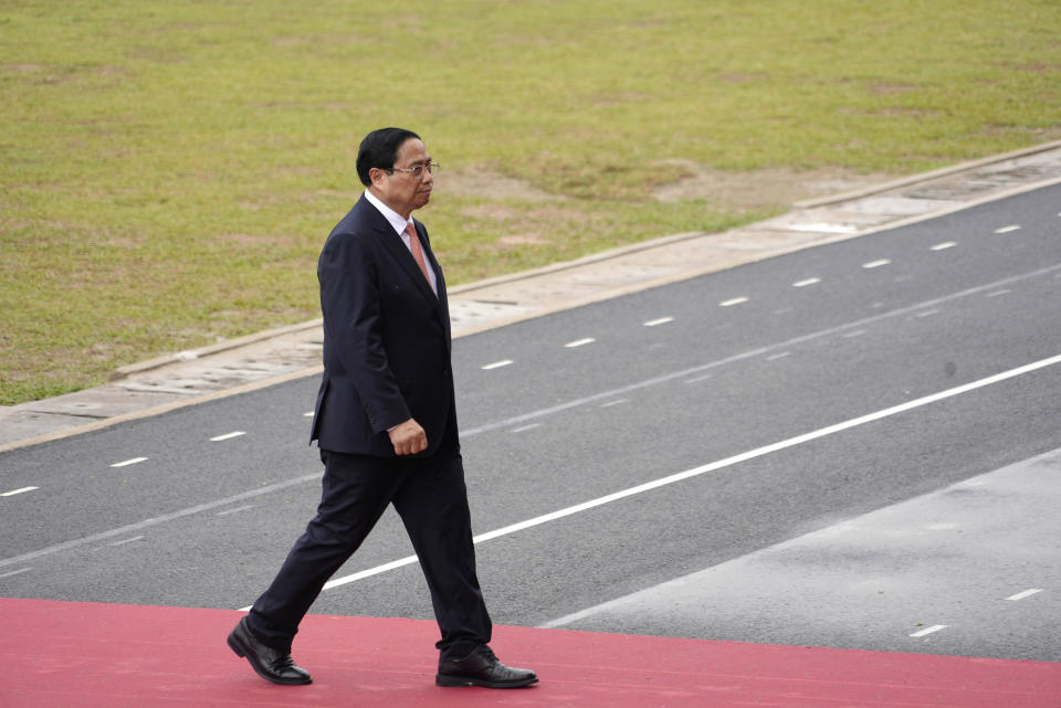 Vietnamese Prime Minister Pham Minh Chinh walks to the podium during a parade commemorating the victory of Dien Bien Phu battle in Dien Bien Phu, Vietnam, Tuesday, May 7, 2024. Vietnam is celebrating the 70th anniversary of the battle of Dien Bien Phu, where the French army was defeated by Vietnamese troops, ending the French colonial rule in Vietnam. (AP Photo/Hau Dinh)