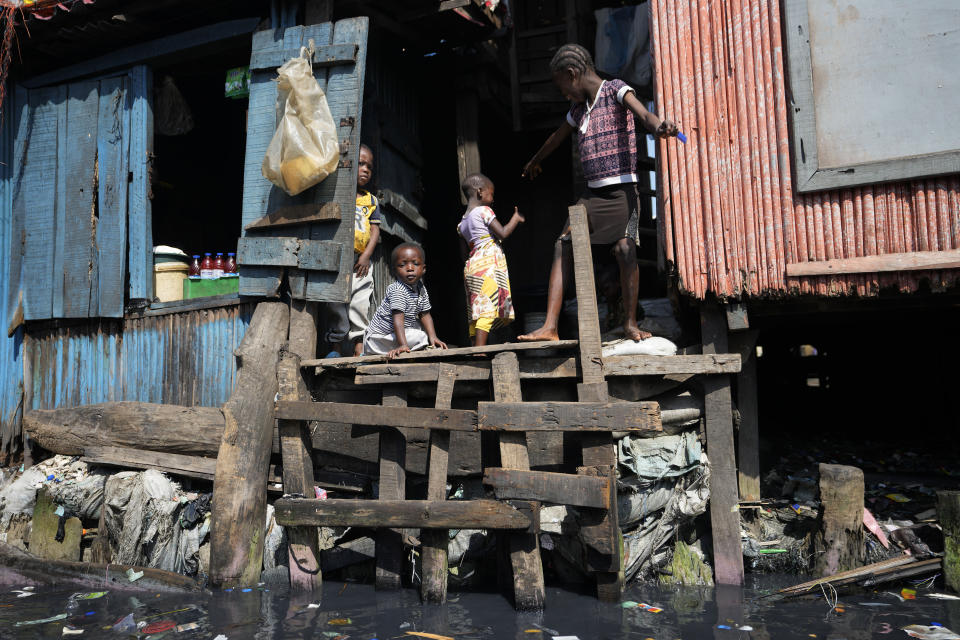 Children play near water in Nigeria's economic capital Lagos' floating slum of Makoko, Monday, March. 20, 2023. March 22 is World Water Day, established by the United Nations and marked annually since 1993 to raise awareness about access to clean water and sanitation. (AP Photo/Sunday Alamba)