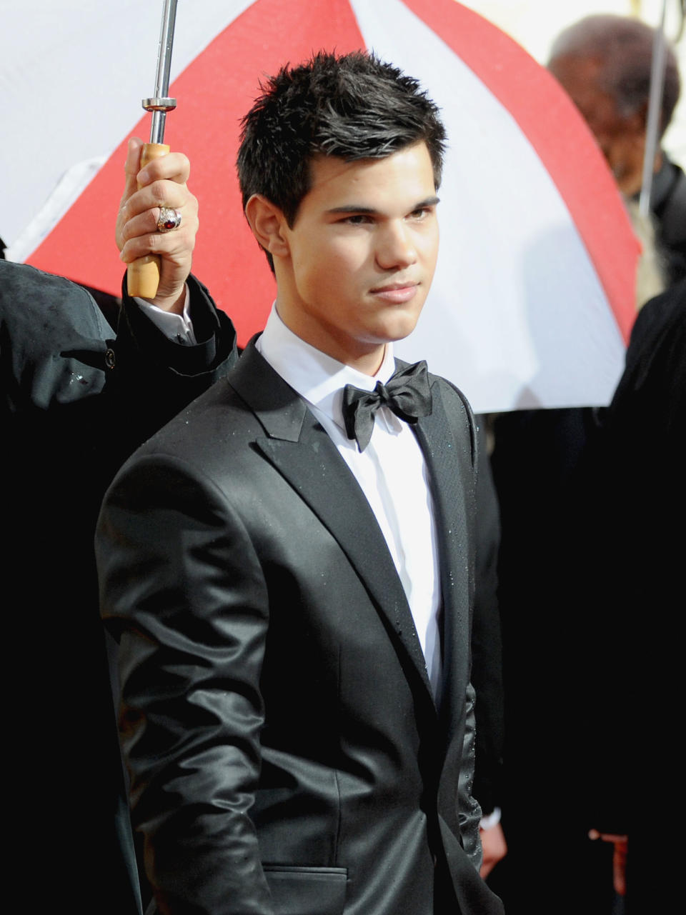 Close-up of Taylor in a bow tie and suit