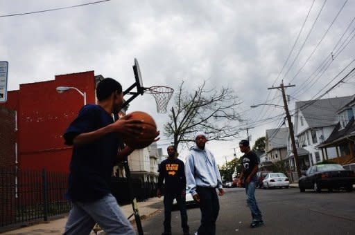 File photo shows teenagers playing basketball in Bridgeport, Connecticut. Nearly half of US teenagers say they'd much rather spend time with friends in the real world, a major survey published Tuesday indicated