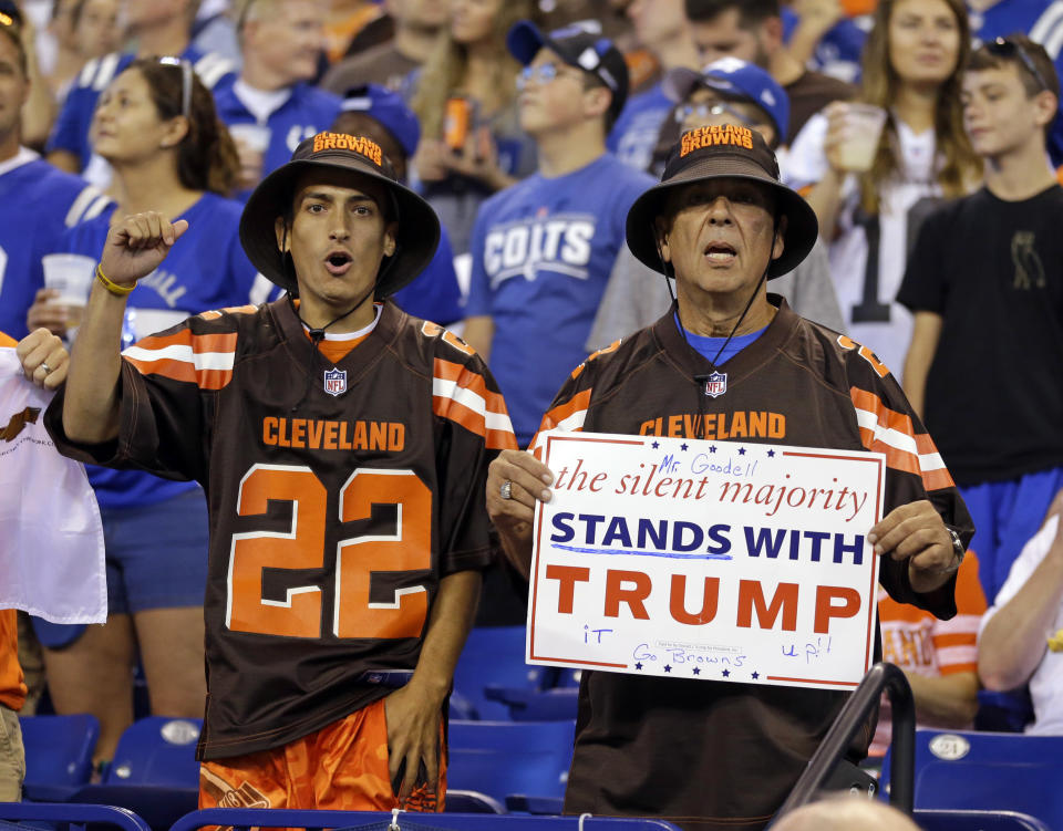 <p>Cleveland Browns fans hold a sign following the national anthem before an NFL football game between the Indianapolis Colts and the Cleveland Browns in Indianapolis, Sept. 24, 2017. (Photo: Michael Conroy/AP) </p>