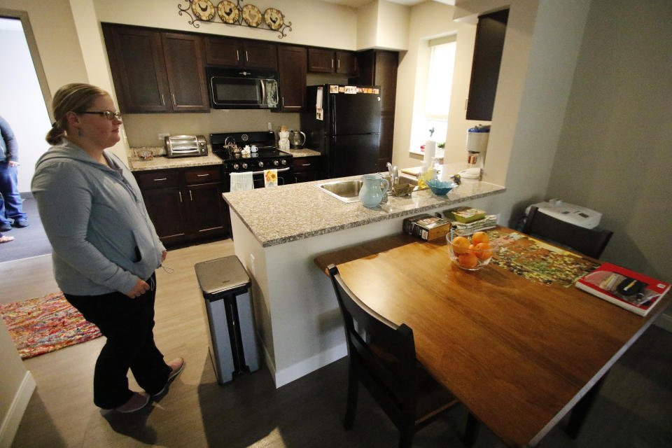 Masha Gregory, an accomplished photographer and artist who is autistic, gives a tour of her apartment in the David Wright apartment complex in Heidelberg, Pa., Thursday, March 30, 2017. Innovative housing developments like this are popping up across the U.S. to serve those who were diagnosed with autism spectrum disorder as children amid increased awareness about the disorder and changes in how it's defined. ( Photo/Gene J. Puskar)( Photo/Gene J. Puskar)