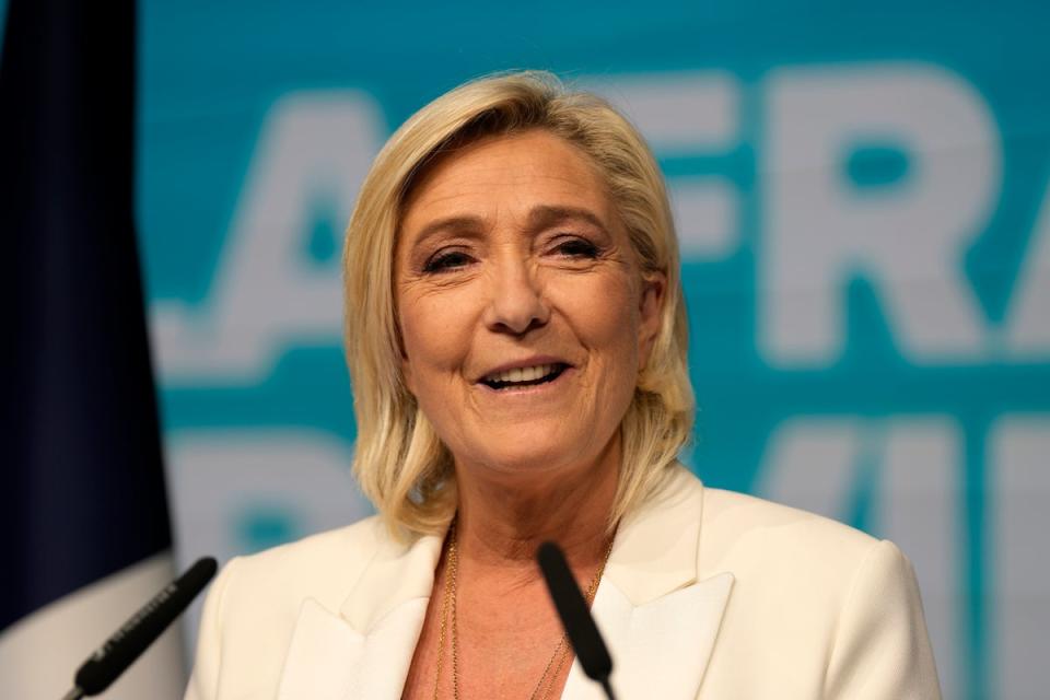 French far-right leader Marine Le Pen delivers her speech at the party election night headquarters on Sunday (AP)