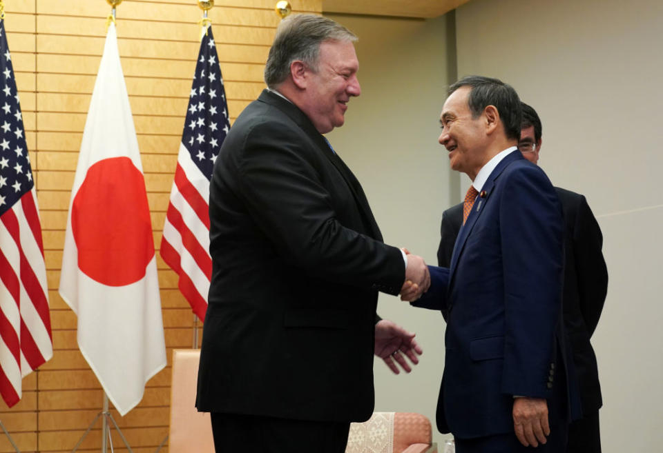 Secretary of State Mike Pompeo (L) speaks to Japan's then-Chief Cabinet Secretary Yoshihide Suga at the prime minister's office in Tokyo on Oct. 6, 2018.<span class="copyright">Eugene Hoshiko—AFP/Getty Images</span>