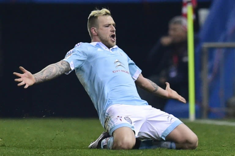 Celta Vigo's forward John Guidetti celebrates after scoring a goal during the Spanish Copa del Rey quarter-finals against Atletico Madrid at the Vicente Calderon stadium in Madrid on January 27, 2016