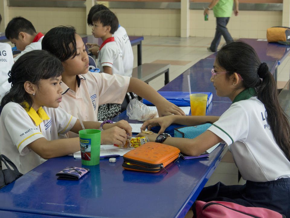 School children in primary school in Singapore. (Photo by: Majority World/Universal Images Group via Getty Images)