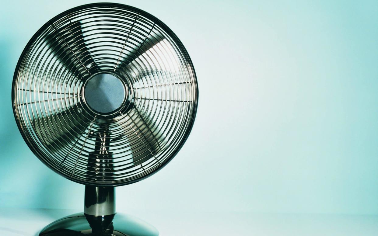 The unusual method of pointing a fan out of a window can help you keep cool in a heatwave  - Digital Vision