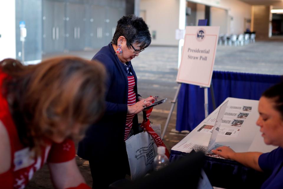 Michele Barnes, of Las Vegas, votes Friday in a straw poll during the National Federation of Republican Women's 42nd Biennial Convention.