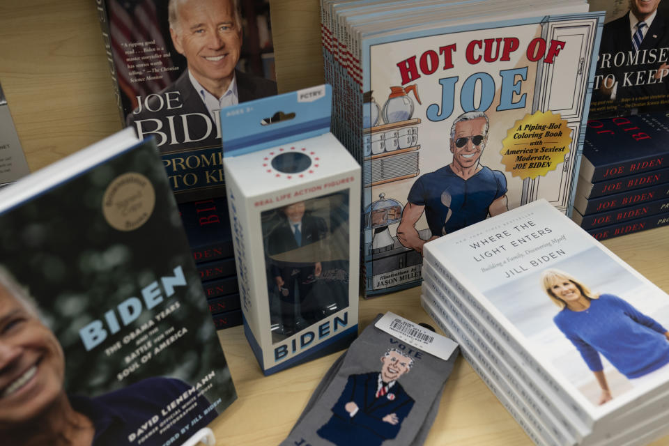 A display of President-elect Joe Biden and Jill Biden books and keepsakes including a "Hot Cup of Joe," coloring book, are available at Browseabout Books, Friday, Nov. 13, 2020, in Rehoboth Beach, Del. (AP Photo/Alex Brandon)