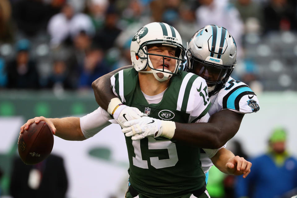 <p>Josh McCown #15 of the New York Jets is sacked by defensive end Mario Addison #97 of the Carolina Panthers during the third quarter of the game at MetLife Stadium on November 26, 2017 in East Rutherford, New Jersey. (Photo by Al Bello/Getty Images) </p>