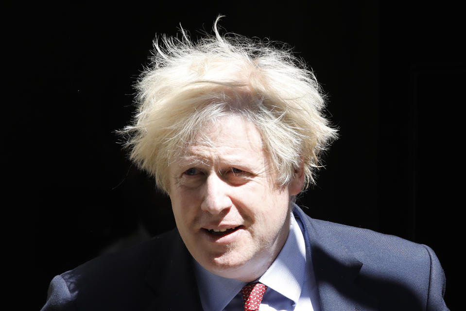 Britain's Prime Minister Boris Johnson leaves 10 Downing Street in central London on May 20, 2020 to attend Prime Minister's Questions (PMQs) in the Houses of Parliament. -  (Photo by Tolga AKMEN / AFP) (Photo by TOLGA AKMEN/AFP via Getty Images)