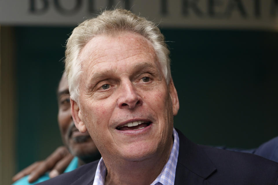 Democratic gubernatorial candidate, former Gov. Terry McAuliffe, greets supporters during a tour of downtown Petersburg, Va., Saturday, May 29, 2021. Republican gubernatorial nominee Glenn Youngkin's campaign announced Monday, July 12, 2021 that the political newcomer would not debate McAuliffe at a perennial event hosted by the state bar association, in part because of the journalist moderator. (AP Photo/Steve Helber)