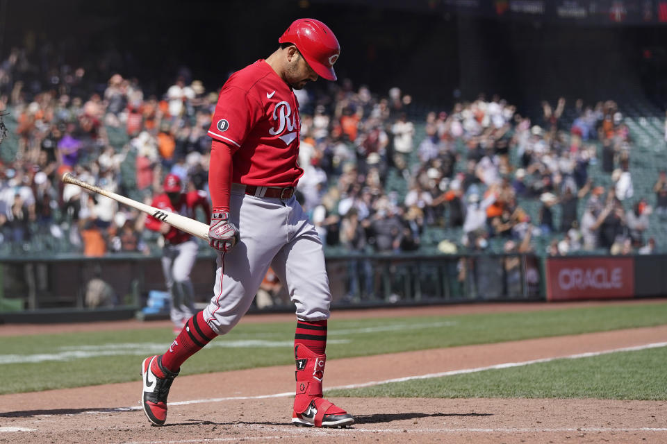 Cincinnati Reds' Eugenio Suarez walks away from the plate after striking out against the San Francisco Giants for the final out of the ninth inning of a baseball game in San Francisco, Wednesday, April 14, 2021. (AP Photo/Jeff Chiu)