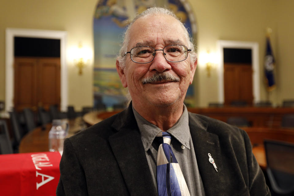 In this June 25, 2019, photo, Oliver “O.J.” Semans, co-founder of Four Directions and a citizen of South Dakota’s Rosebud Sioux Tribe, is photographed on Capitol Hill in Washington. Democratic presidential candidates will descend on Iowa next week to do something that Native Americans say doesn’t happen enough: Court their vote. At least seven White House hopefuls have said they’ll attend a forum in Sioux City on Monday and Tuesday named for longtime Native American activist Frank LaMere, who died in June. Indigenous people hold profound respect for their tribal elders and leaders, who can sway the vote of whole reservations, Semans said. (AP Photo/Kali Robinson)