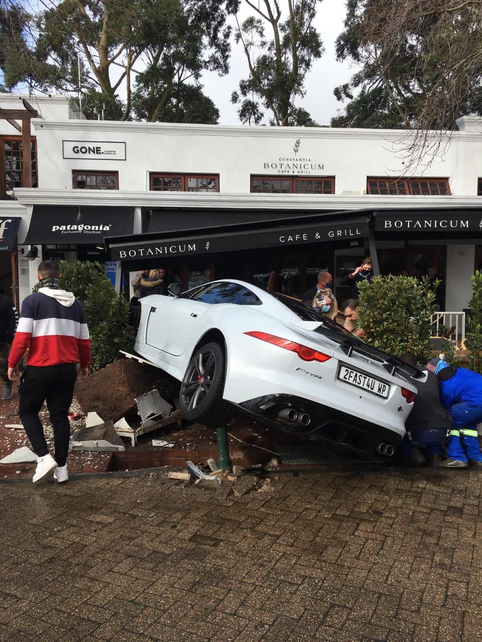 Diners had to scramble for safety as the Jaguar F-Type Coupe ploughed through safety barriers (Picture: SWNS)