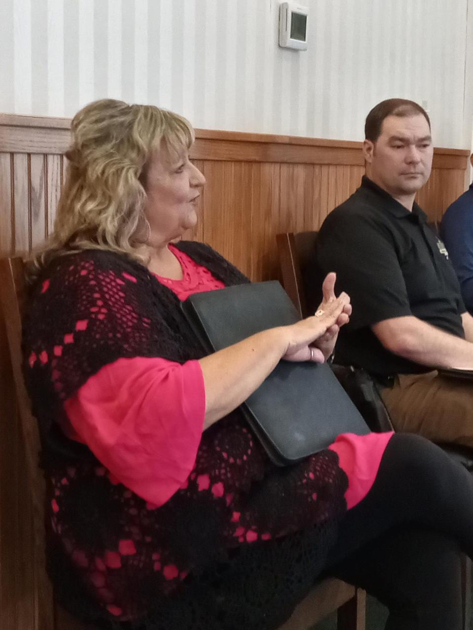 Victim Advocate Tina Zickefoose talks domestic violence with Holmes County Commissioners.