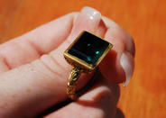 A large emerald ring is pictured in the hand of Sean Fisher, in this photograph taken on June 23, 2011 and released on July 2, 2011. Divers in the Florida Keys recovered the ring and two silver spoons from Nuestra Senora de Atocha, a shipwrecked Spanish galleon that has already yielded one of the greatest treasures ever recovered from the sea. Employees for Mel Fisher's Treasure, named for its founder and Fisher's late grandfather, believe the latest haul signals that they are close to finding the sterncastle, a key missing portion of the ship. Picture taken June 23, 2011. REUTERS/Sharon Wiley/Mel Fisher's Treasures/Handout