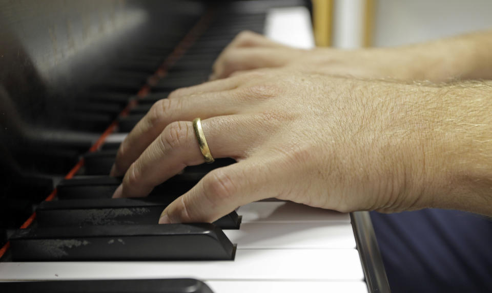 Composer Yotam Haber plays the piano after a rehearsal for his symphony in Birmingham, Ala. on Saturday, Sept. 7, 2013. Rather than focus in a literal way on the Sept. 15, 1963, Ku Klux Klan bombing that killed four little black girls, the Dutch-born composer sought to evoke the city's role in the larger civil rights struggle. "I'm not telling Birmingham her own story," says Haber, whose work is scheduled to premiere at the University of Alabama on Sept. 21, 2013. "She knows it far better than I will ever be able to tell it." (AP Photo/Dave Martin)