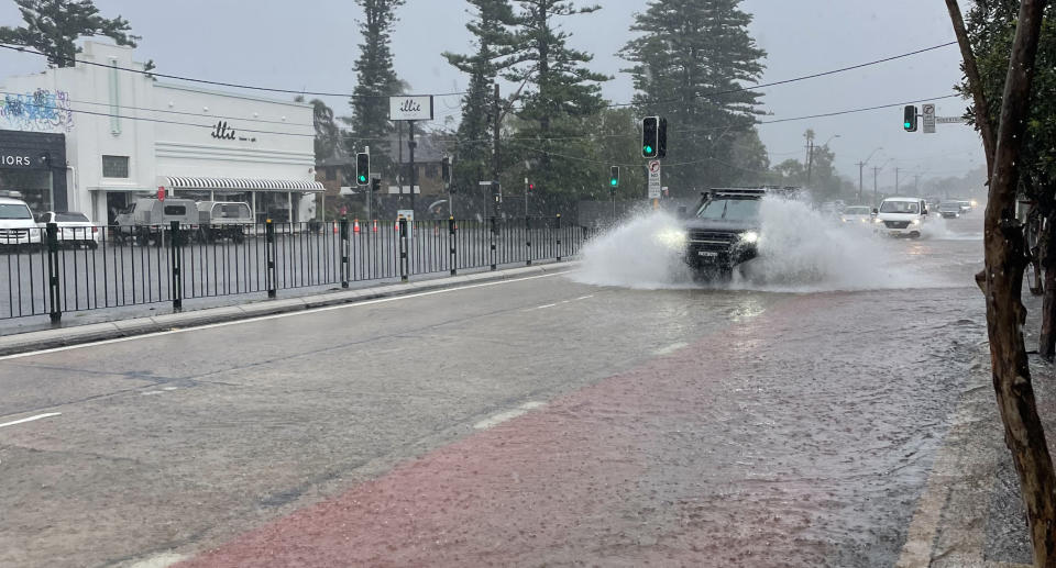 Pittwater Rd at Narrabeen flooded.