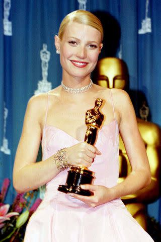 <p>Peter Jordan - PA Images/PA Images via Getty</p> Gwyneth Paltrow wins a Best Actress Oscar at the 1998 Oscars.