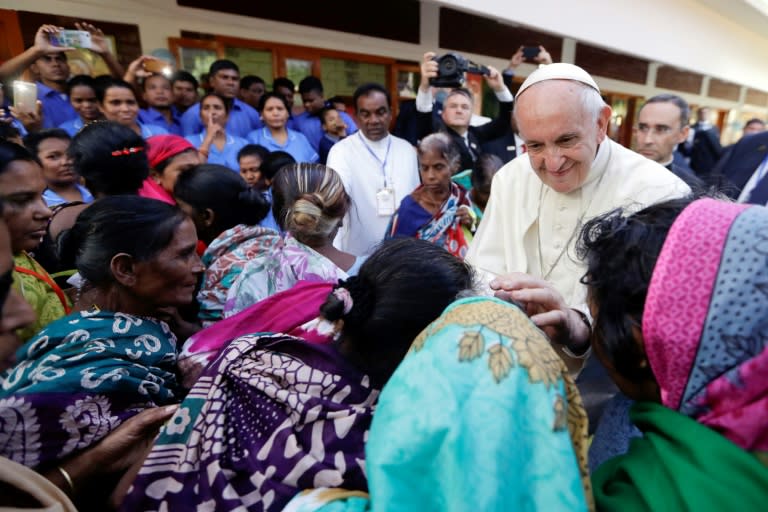 The pope met a group of Rohingya refugees from the squalid camps in southern Bangladesh in an emotional encounter