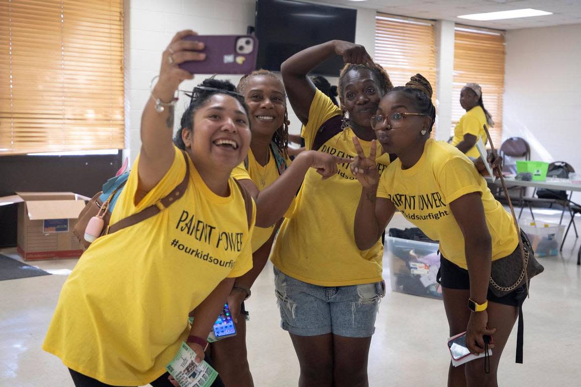 Powerful Parent Movement members Amy Solis, Kim Truss, Yolanda Seban and Trenace Dorsey-Hollins take a selfie before knocking on doors to ask other parents their thoughts on schools in Fort Worth, Texas, on Saturday, Aug. 13, 2022.