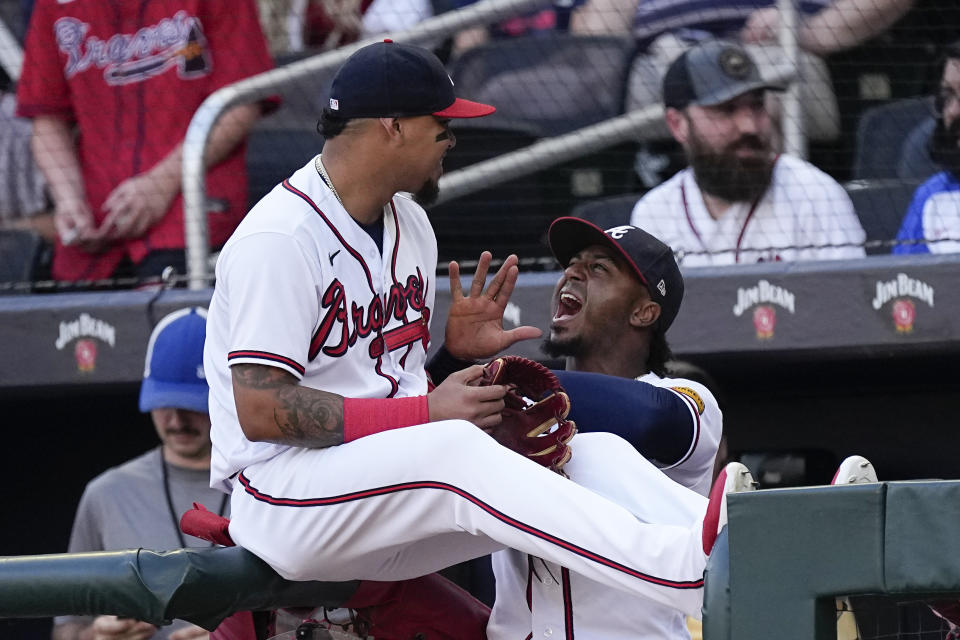 Atlanta Braves second baseman Ozzie Albies, right, jokes with shortstop Orlando Arcia before a baseball game against the Los Angeles Angels, Tuesday, Aug. 1, 2023, in Atlanta. (AP Photo/John Bazemore)