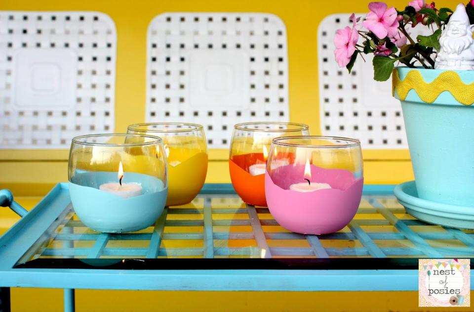 <p>It doesn't get simpler (or cheaper!) than this. Dip dollar-store candle holders in colorful acrylic paint for a peppy tablescape.</p><p><a class="link " href="https://www.amazon.com/Apple-Barrel-Acrylic-2-Ounce-PROMOABI/dp/B00ATJSD8I/?tag=syn-yahoo-20&ascsubtag=%5Bartid%7C10055.g.3620%5Bsrc%7Cyahoo-us" rel="nofollow noopener" target="_blank" data-ylk="slk:SHOP ACRYLIC PAINTS;elm:context_link;itc:0;sec:content-canvas">SHOP ACRYLIC PAINTS</a></p><p><em><a href="http://www.nestofposies-blog.com/2012/06/dipped-votives-dollar-store-craft-idea/" rel="nofollow noopener" target="_blank" data-ylk="slk:Get the tutorial at Nest of Posies »;elm:context_link;itc:0;sec:content-canvas" class="link ">Get the tutorial at Nest of Posies »</a></em> </p>