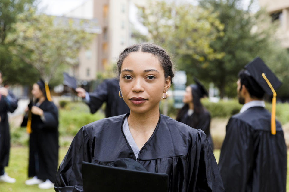 A woman is at her graduation ceremony