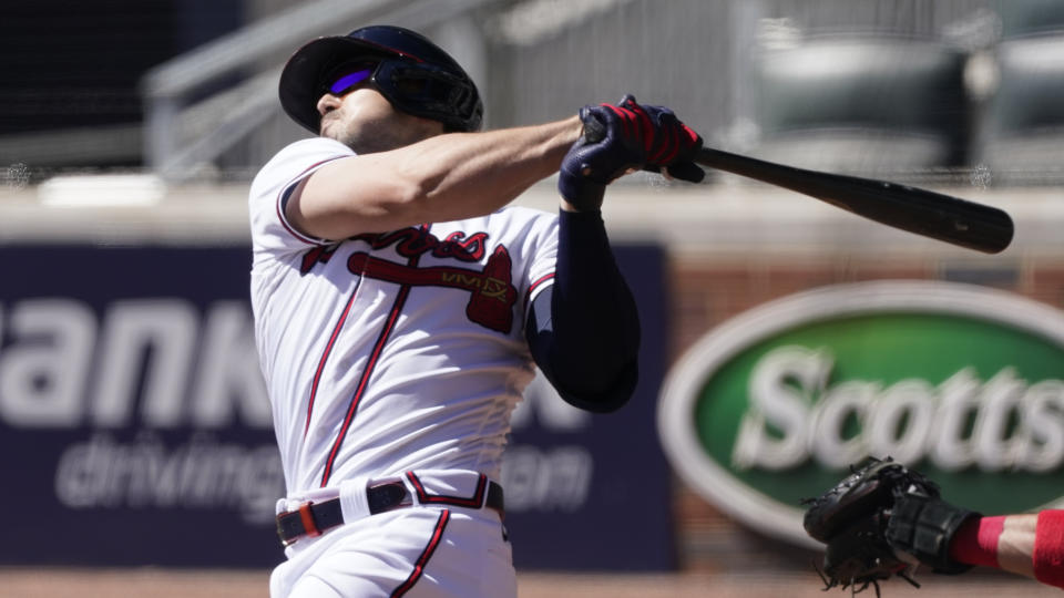 Atlanta Braves left fielder Adam Duvall (23) hits the ball in the third inning against the Cincinnati Reds during Game 1 of a National League wild-card baseball series, Wednesday, Sept. 30, 2020, in Atlanta. (AP Photo/John Bazemore)