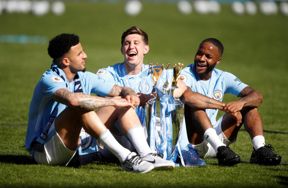 <p>Soccer Football – Premier League – Manchester City vs Huddersfield Town – Etihad Stadium, Manchester, Britain – May 6, 2018 Manchester City’s John Stones, Kyle Walker and Raheem Sterling celebrate with the trophy after winning the Premier League title Action Images via Reuters/Carl Recine EDITORIAL USE ONLY. No use with unauthorized audio, video, data, fixture lists, club/league logos or “live” services. Online in-match use limited to 75 images, no video emulation. No use in betting, games or single club/league/player publications. Please contact your account representative for further details. </p>