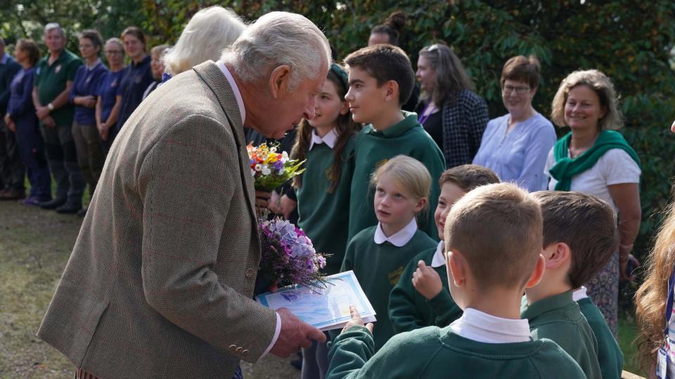 King Charles III and Queen Camilla meet estate staff and members of the public as they depart Crathie Parish Church