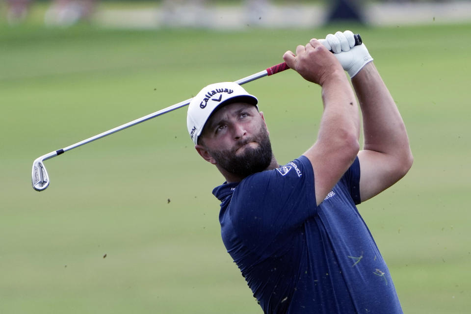 Jon Rahm hits a shot on the first fairway during third round of the Arnold Palmer Invitational golf tournament Saturday, March 4, 2023, in Orlando, Fla. (AP Photo/John Raoux)