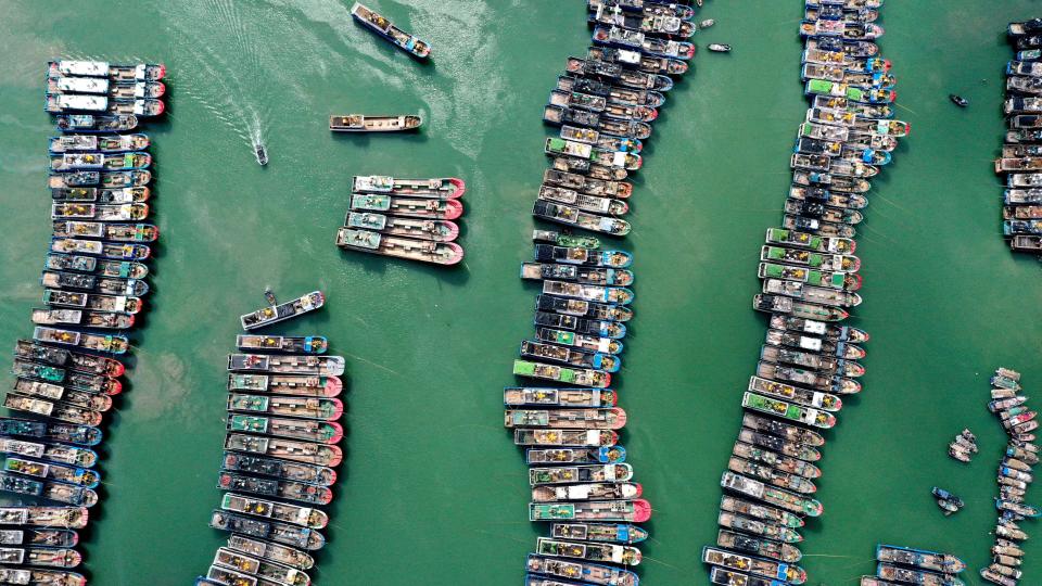 A drone view shows fishing boats being moored as Typhoon Gaemi approaches, in Lianjiang county of Fuzhou, Fujian province