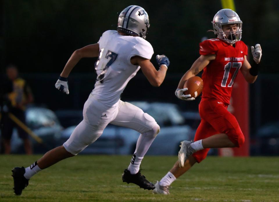West Lafayette Red Devils wide receiver Liam Burton (17) runs with the ball during the IHSAA football game against the Central Catholic, Friday, Sept. 9, 2022, at Straley Field in West Lafayette, Ind. 