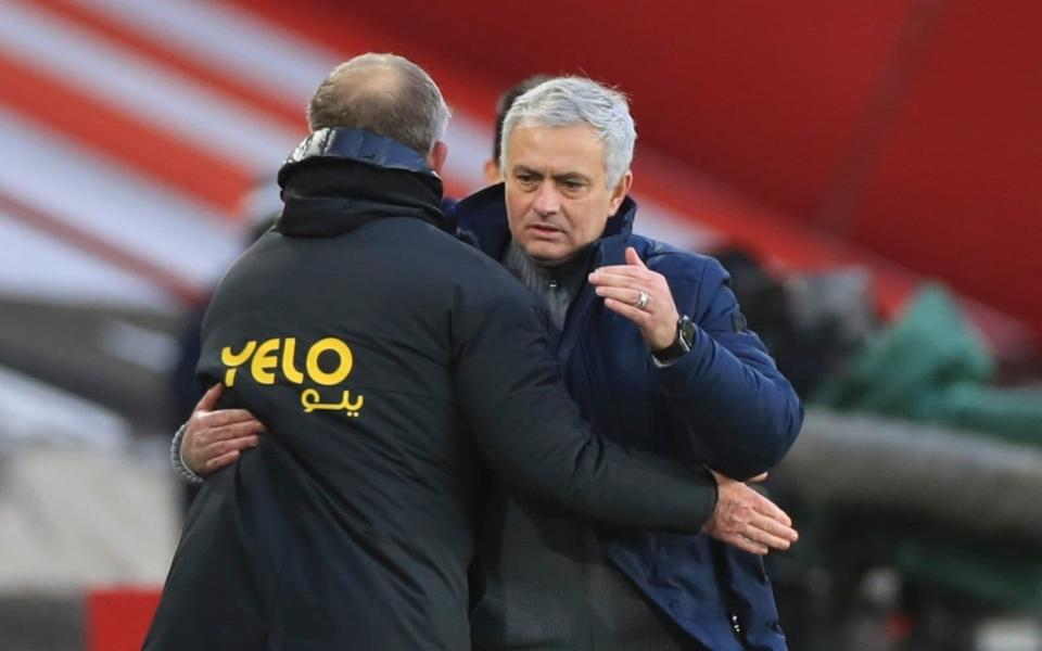 Jose Mourinho and Chris Wilder embrace following the final whistle - PA