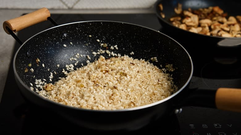 Risotto cooking in black pan