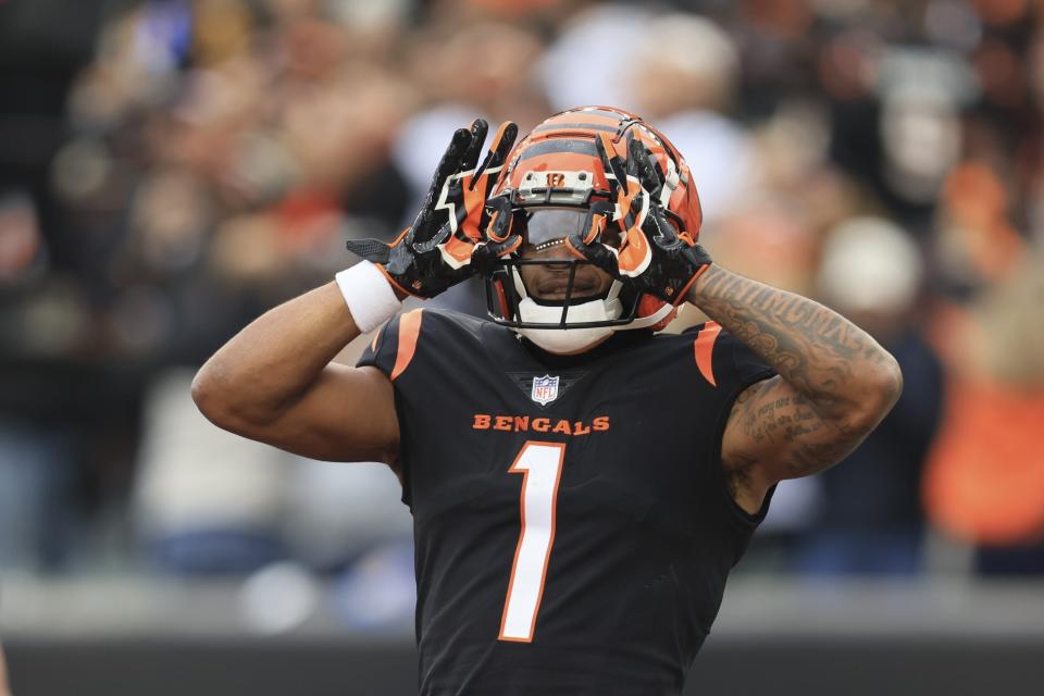 Cincinnati Bengals' Ja'Marr Chase celebrates after a touchdown catch during the first half of an NFL football game against the Cleveland Browns, Sunday, Dec. 11, 2022, in Cincinnati. (AP Photo/Aaron Doster)