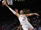 FILE - Phoenix Mercury center Brittney Griner (42) shoots next to Las Vegas Aces center Liz Cambage, obscured, during the first half of Game 5 of a WNBA basketball playoff series Friday, Oct. 8, 2021, in Las Vegas. Since arriving a Moscow airport in mid-February, Griner has been detained by police after they reported finding vape cartridges allegedly containing cannabis oil in her luggage. Still in jail, she is awaiting trial next month on charges that could bring up to 10 years in prison.(AP Photo/Chase Stevens, File)