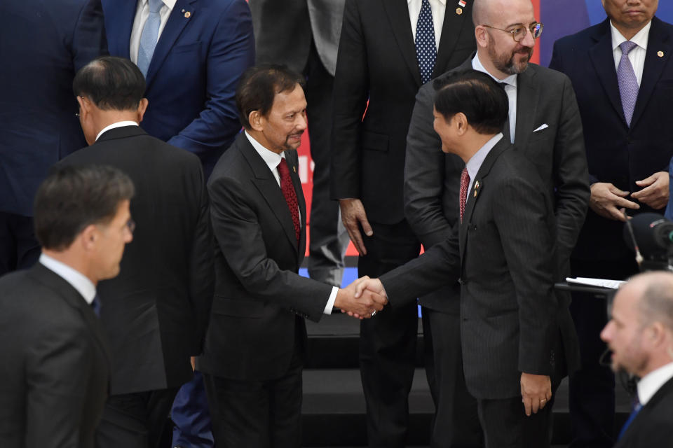 Philippines President Ferdinand Marcos, center right, shakes hands with the Sultan of Brunei Hassanal Bolkiah, center left, during the opening ceremony at an EU-ASEAN summit in Brussels, Wednesday, Dec. 14, 2022. EU and ASEAN leaders meet in Brussels for a one day summit to discuss the EU-ASEAN strategic partnership, trade relations and various international topics. (AP Photo/Geert Vanden Wijngaert)