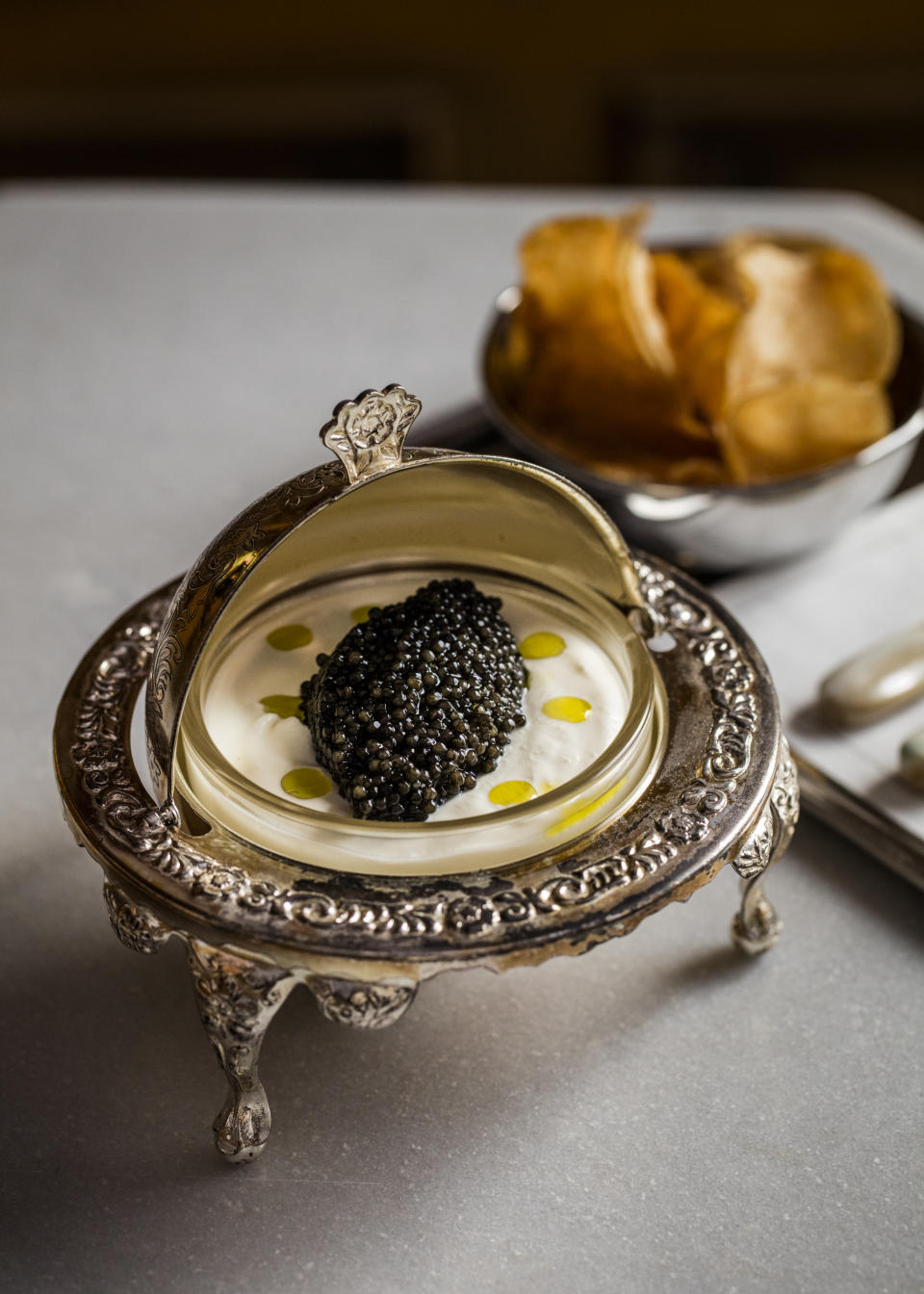 Caviar with potato chips and beer cream. - Credit: Eric Medsker